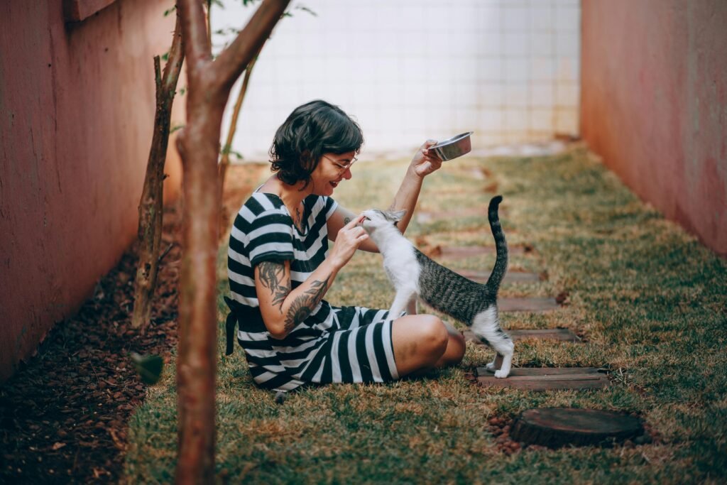 happy cat and woman after incorporating holistic cat care in their routine.